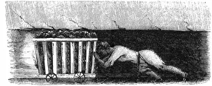 Boy pushing coal wagon in mine at Halifax, Yorkshire