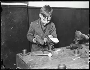 Boy Repairs Boots/1930
