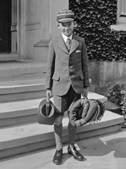 Boy in school uniform with luggage