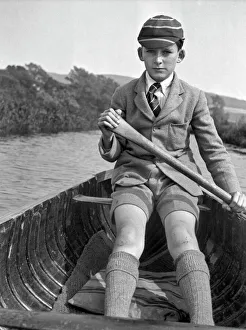 Shorts Collection: Boy in school uniform rowing a boat
