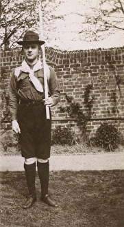 Images Dated 10th February 2017: Boy in scout uniform in garden, Ealing, West London