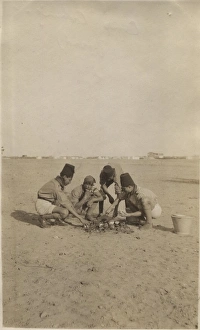 Boy scouts baking bread at camp, Cairo, Egypt
