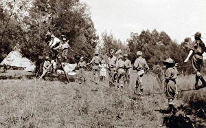 Boy scouts constructing rope bridge, South Africa