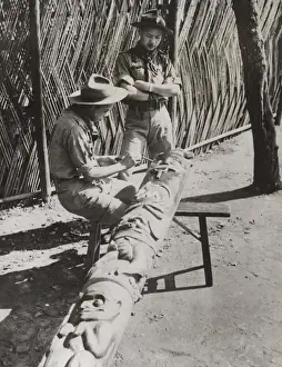 Boy Scouts painting totem pole, Nanking, China