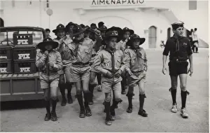 Boy scouts and a sea scout at a port, Greece