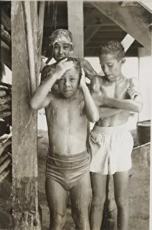 Shower Collection: Boy scouts sharing a shower at camp, British Honduras