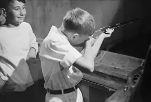 Sturgeon Prints: Boy shooting during carnival at firemens convention, Sturge