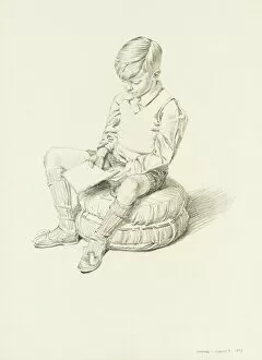 Boy sitting and reading