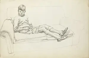 Lounging Prints: Boy sitting on a two-seat sofa