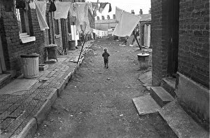 Boy in slum housing yard Boy in slum housing yard