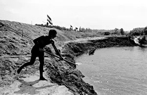 Boy with a spade, taking part in a Communist Youth labour camp in former Yugoslavia