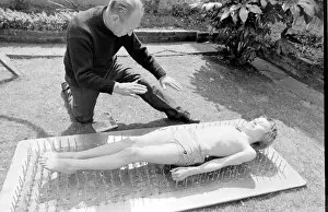 Youngest Gallery: Boy stuntman on bed of nails