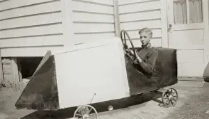 Boy in a toy car