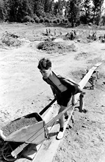 Images Dated 14th August 2015: Boy with a wheelbarrow, taking part in a Communist Youth labour camp in former Yugoslavia