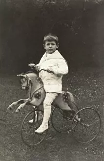 Boy on a wheeled horse