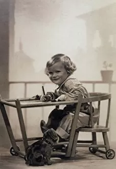 Boy Writing in Playpen