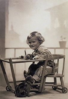 Images Dated 14th August 2017: Boy Writing in Playpen