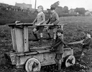 Images Dated 3rd February 2016: Boys on an 18th century fire engine, Wirksworth
