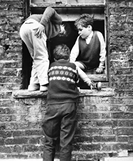Sill Gallery: Boys at a boarded up window, Balham, SW London