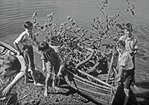 Images Dated 3rd February 2015: Boys with boat full of tree branches