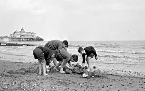 Teamwork Prints: Boys building a sandcastle, Eastbourne, Sussex