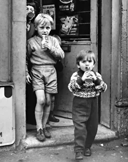 Coming Prints: Boys coming out of a sweet shop, Balham, SW London
