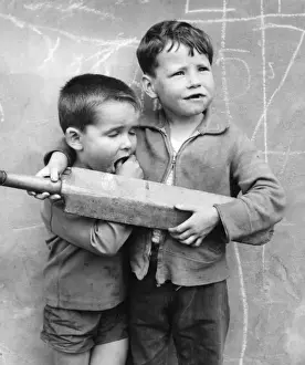 Sleepy Prints: Two boys with cricket bat on a Balham street, SW London