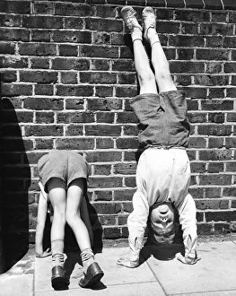 Acrobatics Gallery: Boys doing handstands on a Balham street, SW London
