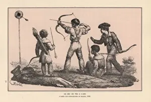 Boys firing arrows at a target in an archery