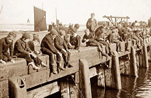 Crab Collection: Boys fishing on a pier early 1900s