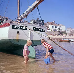 Two boys in the harbour, St Ives, Cornwall