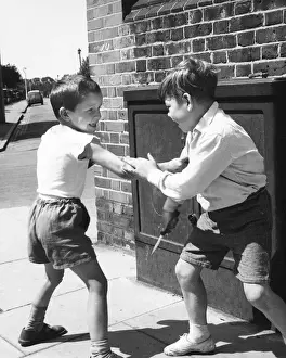 Urchins Prints: Two boys having mock fight, Balham, SW London