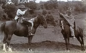 Images Dated 21st October 2016: Two boys on horseback playing Cowboys and Indians