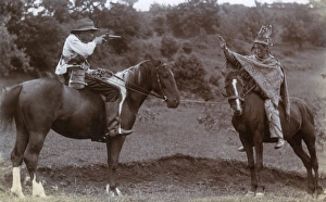 Images Dated 21st October 2016: Two boys on horseback playing Cowboys and Indians