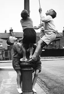 Boys on a lamp post on a Balham street, SW London