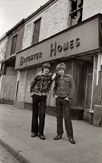 Two boys outside Brighter Homes