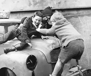 Chassis Prints: Boys playing on a car in a Balham street, SW London