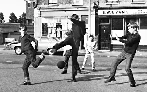 Boys playing football in a street, Balham, SW London