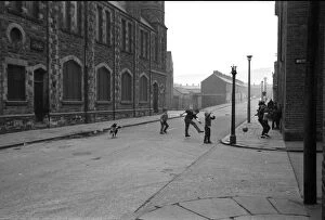 Images Dated 11th September 2015: Boys playing football in a street, Belfast, Northern Ireland