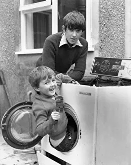 Fooling Gallery: Two boys playing in old washing machine
