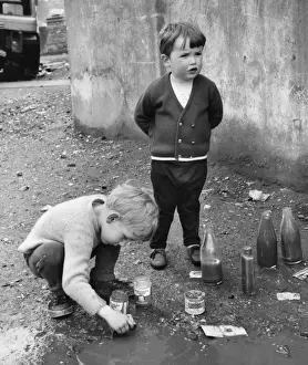Messy Prints: Boys playing in a puddle, Balham, SW London