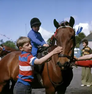 Hard Prints: Boys with a pony at a street party