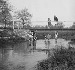 Images Dated 9th March 2015: Boys in a stream and on a bridge