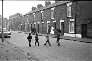 Boys in a street with a flag, Belfast, Northern Ireland