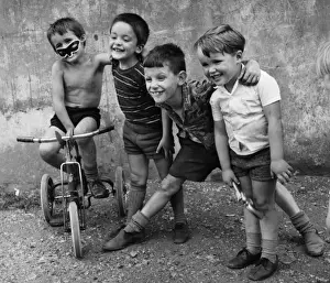 Grinning Prints: Boys with a tricycle in a Balham street, SW London