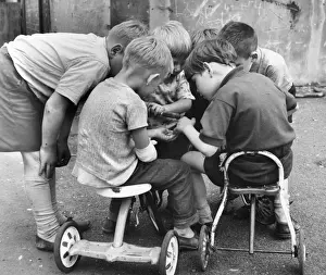 Battered Prints: Boys with tricycles in a Balham street, SW London