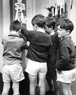 Urchins Prints: Boys using bubble gum machine, Balham, SW London