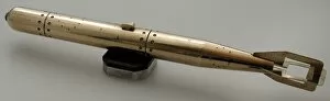 Torpedo Gallery: Brass model of torpedo sitting on bakelite and metal stand