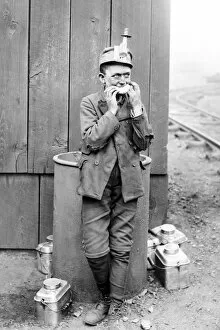 Breaker Gallery: Breaker boy eating during a food break at a coal mine in Kin