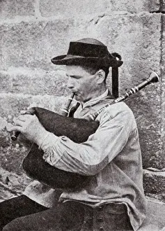 Bretagne Prints: Breton musician playing bagpipes, Brittany, Northern France